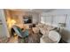 Cozy living room features comfortable seating and a ceiling fan at 3301 Alt 19 # 500, Palm Harbor, FL 34683