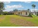 Wide lawn with lush landscaping surrounding property at 3311 Stonebridge Trl, Valrico, FL 33596