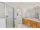 Bathroom with a double vanity and a glass-enclosed shower at 3311 Stonebridge Trl, Valrico, FL 33596