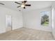 Light-filled bedroom featuring neutral carpet and a ceiling fan at 3311 Stonebridge Trl, Valrico, FL 33596
