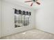 Bright bedroom features a ceiling fan and sunny window at 3311 Stonebridge Trl, Valrico, FL 33596