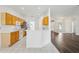 Open kitchen with stainless appliances, white countertop bar open to living area at 3311 Stonebridge Trl, Valrico, FL 33596