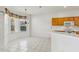 Bright kitchen with a view of the eat-in kitchen that features natural lighting and a chandelier at 3311 Stonebridge Trl, Valrico, FL 33596