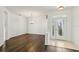 Bright living room featuring hardwood floors and natural light with dining room view at 3311 Stonebridge Trl, Valrico, FL 33596