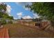 Backyard featuring a deck and well-maintained lawn at 3411 W Beach St, Tampa, FL 33607