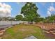 Backyard featuring a wooden deck surrounded by lush landscaping at 3411 W Beach St, Tampa, FL 33607