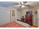 Cozy bedroom with ceiling fan, closet and dresser for ample storage at 3411 W Beach St, Tampa, FL 33607