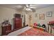 Bedroom featuring stylish decor, dresser with TV, and doorway at 3411 W Beach St, Tampa, FL 33607