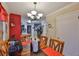 Warm dining room with wood table and access to kitchen space, features a modern lighting fixture at 3411 W Beach St, Tampa, FL 33607