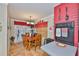 View of dining room with table, wooden chairs, lighting fixture, and access to the backyard at 3411 W Beach St, Tampa, FL 33607