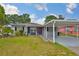 Charming single-story home with a carport and well-maintained front lawn at 3411 W Beach St, Tampa, FL 33607
