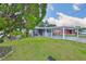 Charming single-story home with a carport and well-maintained front lawn at 3411 W Beach St, Tampa, FL 33607