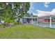 Charming single-story home with a carport and well-maintained front lawn at 3411 W Beach St, Tampa, FL 33607
