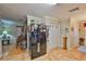 View of the kitchen with stainless steel appliances, tiled floor, and access to other rooms at 3411 W Beach St, Tampa, FL 33607