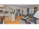 Open-concept living area featuring hardwood floors, bar, and kitchen at 3411 W Beach St, Tampa, FL 33607