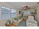 Cozy living room with large windows, hardwood floors and comfortable seating at 3411 W Beach St, Tampa, FL 33607