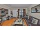 Cozy living room with hardwood floors and modern leather furniture at 3411 W Beach St, Tampa, FL 33607