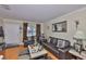Cozy living room with hardwood floors and modern leather furniture at 3411 W Beach St, Tampa, FL 33607