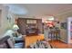 Inviting living room featuring hardwood floors, piano, and bar area at 3411 W Beach St, Tampa, FL 33607