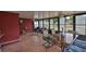 Bright sunroom with brick floors, comfortable seating, and large windows at 3411 W Beach St, Tampa, FL 33607