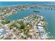 An aerial view shows the home nestled in a charming waterfront community with easy access to the ocean at 366 12Th Ave, Indian Rocks Beach, FL 33785