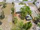 A bird's eye view shows the property and its surroundings, including a grassy yard and mature trees at 366 12Th Ave, Indian Rocks Beach, FL 33785