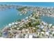 An aerial view shows the house on a street that is surrounded by water, showcasing the waterfront community at 366 12Th Ave, Indian Rocks Beach, FL 33785