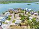 A high aerial view shows a residential home surrounded by scenic waterways, blending comfort with waterfront living at 366 12Th Ave, Indian Rocks Beach, FL 33785