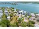 An aerial view displays the property in a charming residential area near the water, showcasing its desirable location at 366 12Th Ave, Indian Rocks Beach, FL 33785