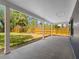 The covered back porch provides ample room for outdoor living with views to the fenced backyard at 366 12Th Ave, Indian Rocks Beach, FL 33785