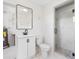 Bright bathroom with white vanity, modern fixtures, glass enclosed tiled shower, and tile flooring at 366 12Th Ave, Indian Rocks Beach, FL 33785