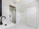 Bright bathroom with white vanity, modern fixtures, glass enclosed tiled shower, and tile flooring at 366 12Th Ave, Indian Rocks Beach, FL 33785