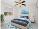 Well-lit bedroom with a cozy bed, modern decor, and a large window, creating a relaxing and inviting space at 366 12Th Ave, Indian Rocks Beach, FL 33785