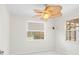 Bright bedroom with white walls, and white marble-patterned tile flooring, featuring a fan at 366 12Th Ave, Indian Rocks Beach, FL 33785