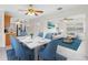 Open concept dining and living area with a dining table with six chairs and a modern living room set at 366 12Th Ave, Indian Rocks Beach, FL 33785