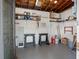 Garage interior with painted walls, shelving, painted floor, and visible storage items at 366 12Th Ave, Indian Rocks Beach, FL 33785