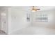 Bright living room featuring white walls, tile floors, a ceiling fan, and natural light at 366 12Th Ave, Indian Rocks Beach, FL 33785