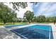 Community basketball courts with multiple hoops surrounded by lush greenery at 3716 Janus Way, Palm Harbor, FL 34685