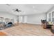 Vast bonus room with music area and office space, with wood-look flooring at 3716 Janus Way, Palm Harbor, FL 34685