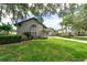 Well maintained home with lush landscaping and a beautiful lawn at 3716 Janus Way, Palm Harbor, FL 34685