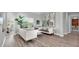 Modern living room featuring hardwood floors, comfortable seating, and stylish decor at 3716 Janus Way, Palm Harbor, FL 34685