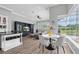 Living space with dining area, lots of natural light, and view of the pool area at 3716 Janus Way, Palm Harbor, FL 34685