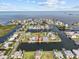 Panoramic aerial view of coastal community with waterfront homes and beautiful ocean views at 4274 Deleon Dr, Hernando Beach, FL 34607
