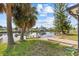 Backyard waterway views with a boat dock and lush landscaping at 4274 Deleon Dr, Hernando Beach, FL 34607
