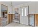 Renovation underway in the entryway, showcasing natural light from the front door and adjacent window at 4274 Deleon Dr, Hernando Beach, FL 34607