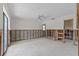Large living room for renovation, featuring a ceiling fan, and great natural light at 4274 Deleon Dr, Hernando Beach, FL 34607