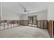 Large living room with ceiling fan, slider, and awaiting renovation and your personalized touches at 4274 Deleon Dr, Hernando Beach, FL 34607