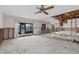 Open-concept living room renovation in progress, featuring sliding glass doors to the lanai at 4274 Deleon Dr, Hernando Beach, FL 34607