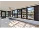 Sunroom featuring wall to wall windows, ceiling fan and lots of bright light and relaxing water views at 4274 Deleon Dr, Hernando Beach, FL 34607
