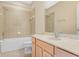 Bathroom featuring a bathtub, a vanity with sink, and neutral tile at 4528 Amberly Oaks Ct, Tampa, FL 33614